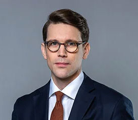 Porträttbild på statssekreterare Erik Scheller.