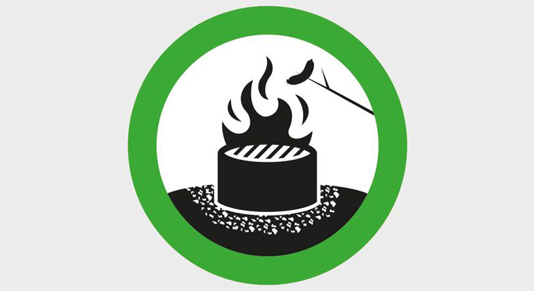 Illustration av öppen eld på eldstad med grön ring runt
